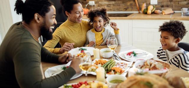 Young Family Enjoying Dinner